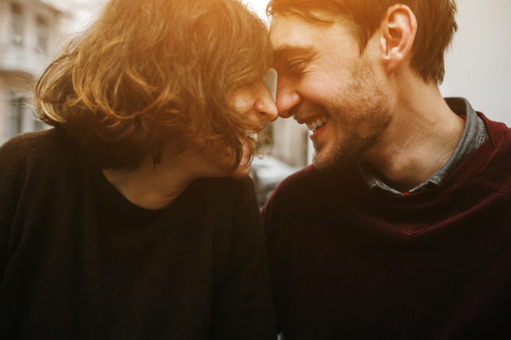 Vintage couple hugs and laughing .Coffee shop