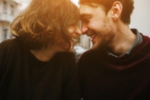 Vintage couple hugs and laughing .Coffee shop